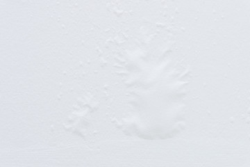 Closeup of the white wall swelling.
