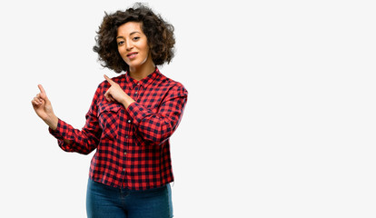 Beautiful arab woman pointing away side with finger