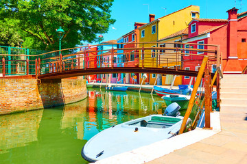 Fototapeta na wymiar Bridge and colorful houses by canal in Burano
