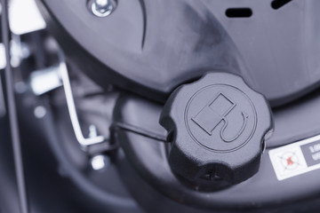 Detail of the stopper of the fuel tank of a mower