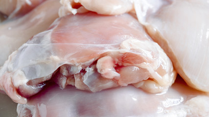 Fresh skinless chicken thighs. Food background. Close up