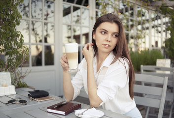 Obraz premium a girl in a summer cafe