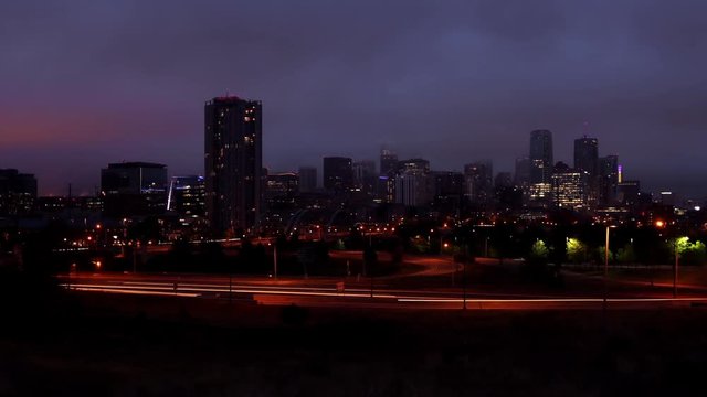 Denver Skyline Dramatic Sunrise in Fog Timelapse Pan and Zoom In
