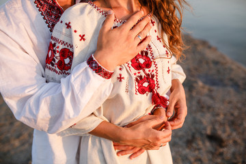 Beautiful couple in national Ukrainian embroidered shirts shirt.