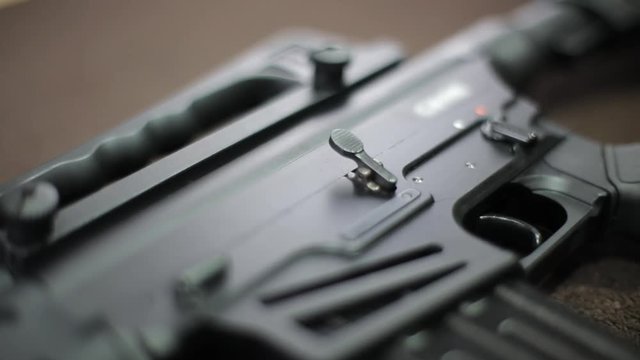 Close-up view of tactical gun on the table