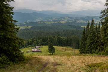 Fototapeta na wymiar Panorama view to wooden houses near the mountains, Carpathian, Ukraine