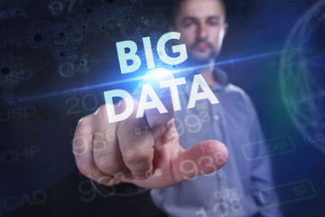 Obraz premium The concept of business, technology, the Internet and the network. A young entrepreneur working on a virtual screen of the future and sees the inscription: Big data
