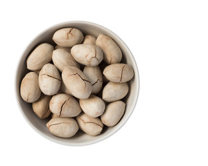 Full bowl of pecan nuts in shell, isolated on white background.