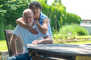 happy senior couple in the garden