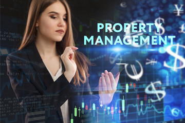 The concept of business, technology, the Internet and the network. A young entrepreneur working on a virtual screen of the future and sees the inscription: Property management