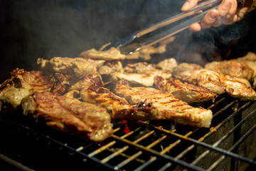Cooking meat on barbeque grill