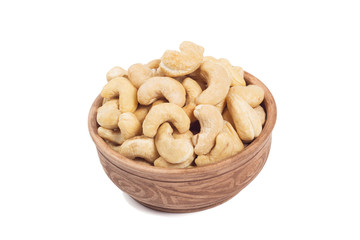 Cashew in brown cup isolated on the white background
