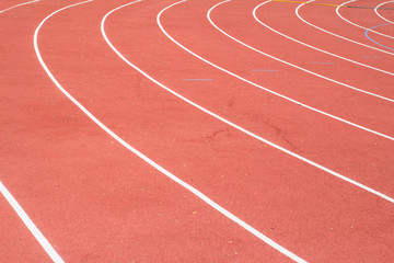 All-weather running track , orange and white lanes for running training