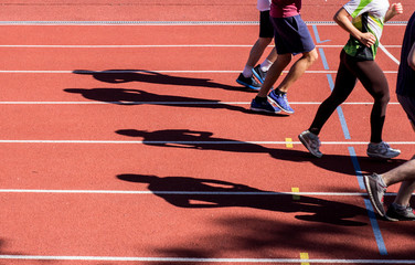 All-weather running track , orange and white lanes for running training