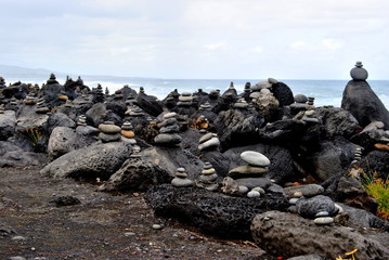 Reunion island seascape, landscape. Black sand, volcanic rocks.