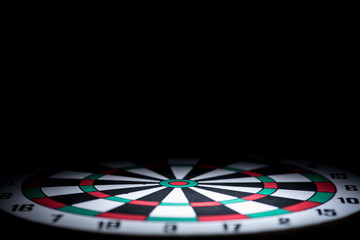 Obraz premium abstract dartboard on dark background lighted with snoot