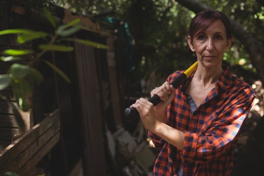 Portrait Of Mature Lumberjack Holding Axe