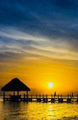 Fototapeta na wymiar sun sea tropical sunset view of the pier of the caribbean