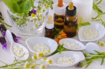 Obraz na płótnie Canvas Alternative Medicine. Homeopathy. Homeopathic globules and essential oils.