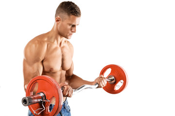Young muscular man doing bicep barbell curl exercise