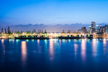 singapore skyline in evening time, view from open deck of a cruise ship