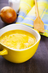 Cheese soup in a yellow plate