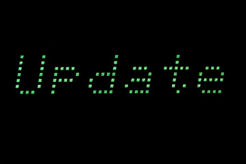 Update digital message, green led text matrix Close-up detail of a message from a led monitor