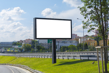 Between two ways billboard canvas mockup in city and blue sky background. Beautiful weather