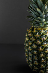 ripe pineapple on a black table