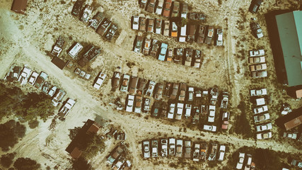Overhead view of old cars gathered in a countryside parking
