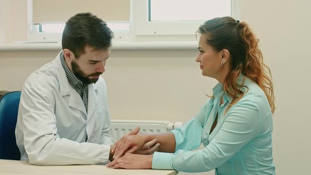 Professional dermatologist examining birthmarks and moles of a patient