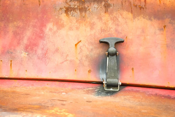 rusting metallic panel and latch background