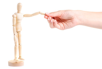 Wooden figure of a man in a hand on a white background isolation