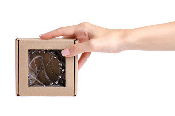 Ornament for hair wreath hoop silver stones hairstyle styling in box in hand on a white background isolation