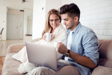 Couple on internet with laptop