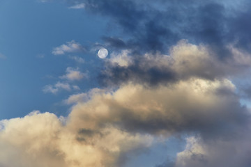 Clouds and moon at the morning sky