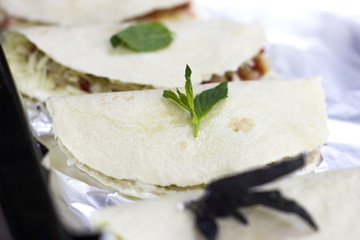 Hot mexican food quesadilla on a tray of oven