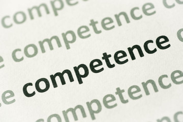 Fototapeta premium word competence printed on paper macro