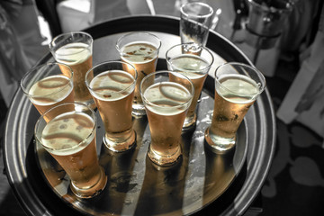 A lot of pints of Beer on black tray