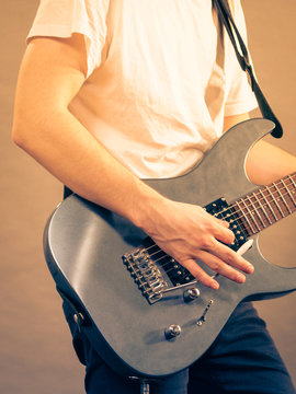 Man playing on electric guitar