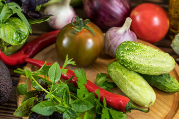 Many delicious juicy colorful summer vegetables and herbs