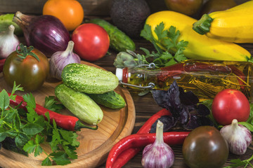 Many delicious juicy colorful summer vegetables and herbs