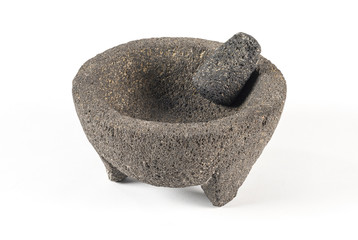 Mexican mortar and pestle. Traditional grinding utensil used to make salsa in Mexico