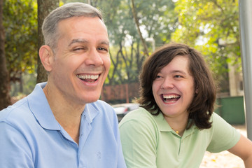 Fototapeta premium Mature dad and son. Father Day. Young male is talking and laughing with his parent. Concept of family, bonding, enjoyment.