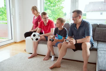 Zelfklevend Fotobehang Grandparents, their son and grandson are emotionally ill for the national team © spass