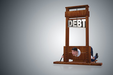 Businessman in heavy debt business concept