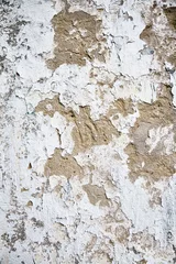 Fotobehang Verweerde muur Witte oude muur met gebarsten pleister.