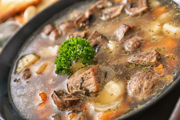 Pan with stewed meat and potatoes, closeup