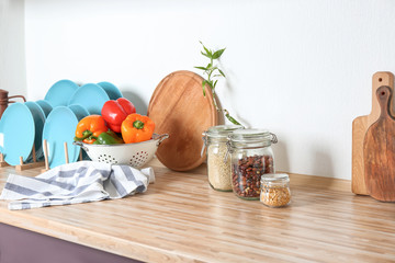 Different kitchenware on table
