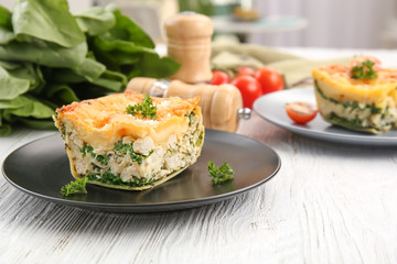 Lasagna with spinach on table